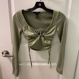Green long sleeve top with open hole neckline. Worn once in EUC. Size XS